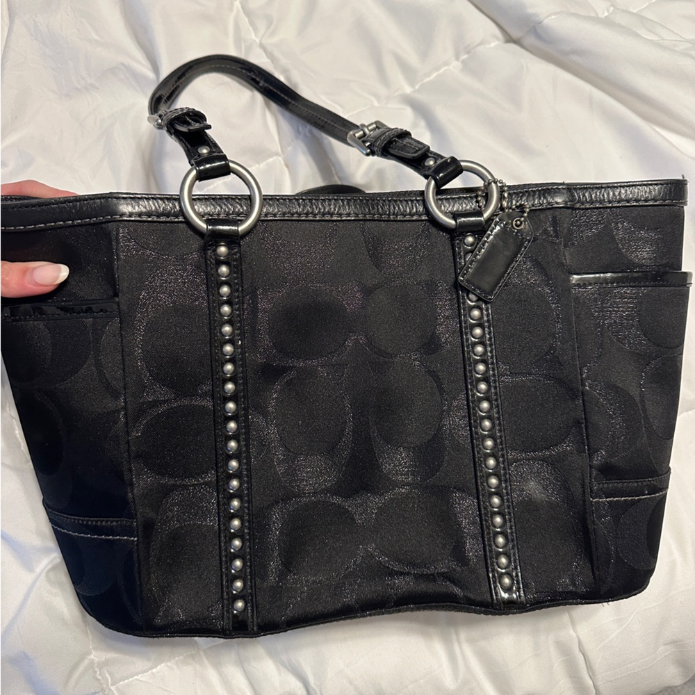 Coach studded black handbag with metallic details